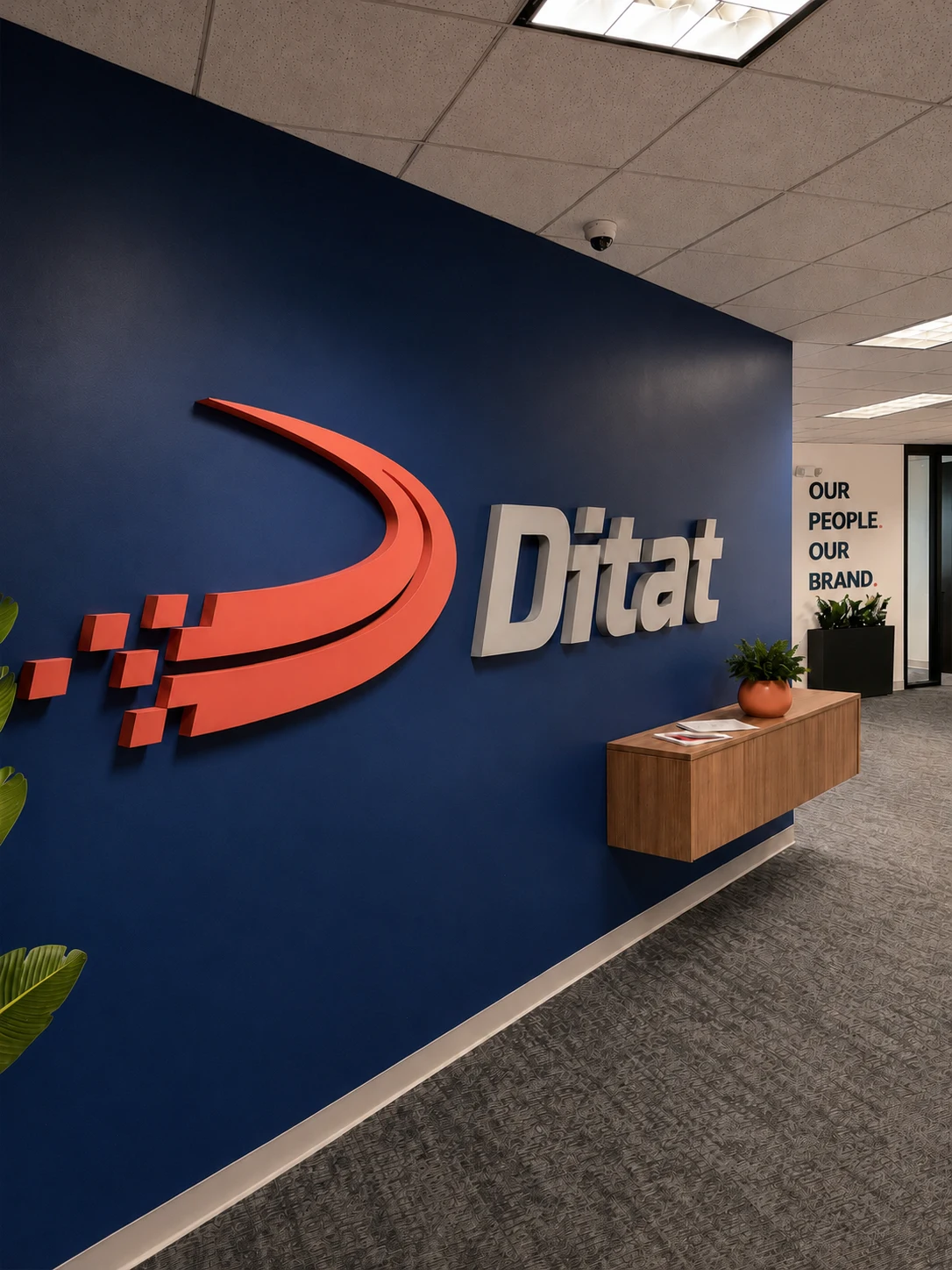 Ditat office reception with the Ditat logo wall